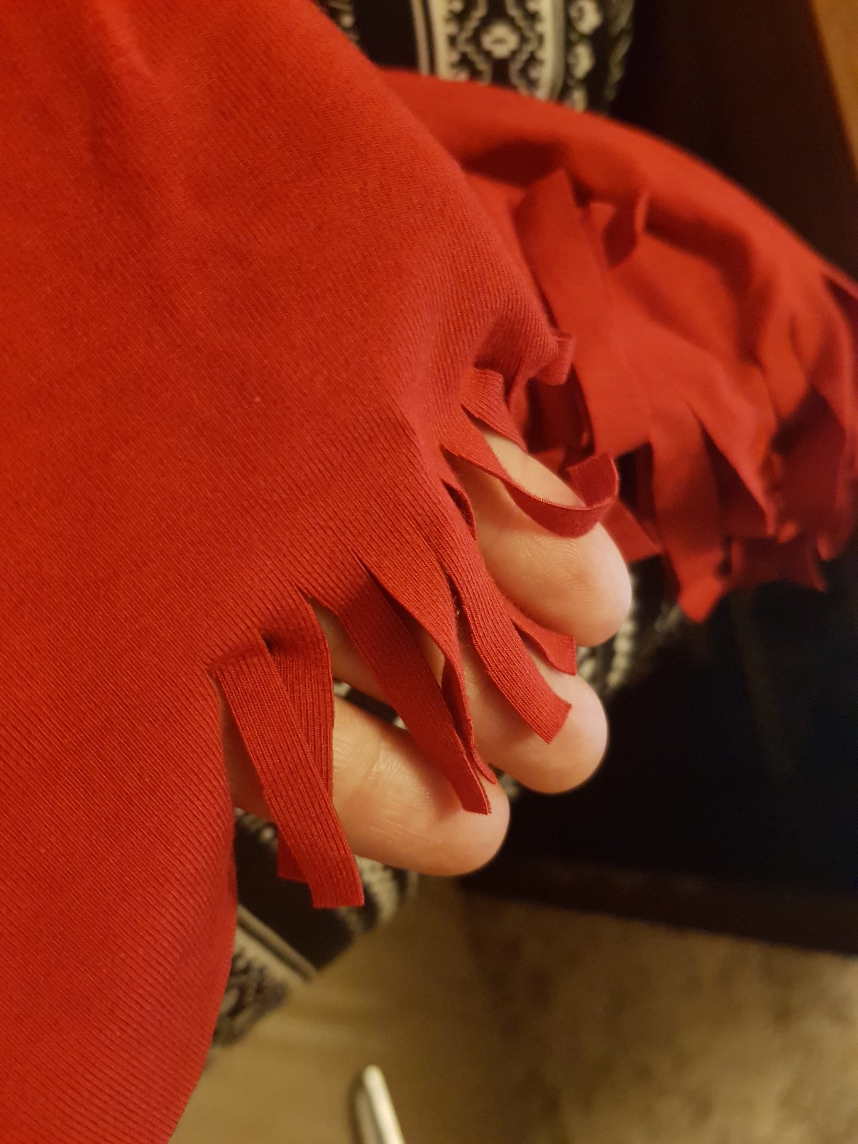red tshirt fringes closeup